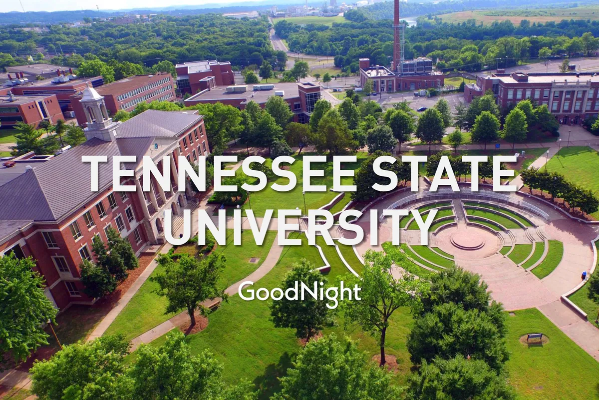 A broad exterior shot of Tennessee State University, highlighting its open courtyard, lush greenery, and inviting walking paths. The tranquil, campus-like environment conveys opportunities for restorative outdoor walks and a sense of calm within the surrounding neighborhood.